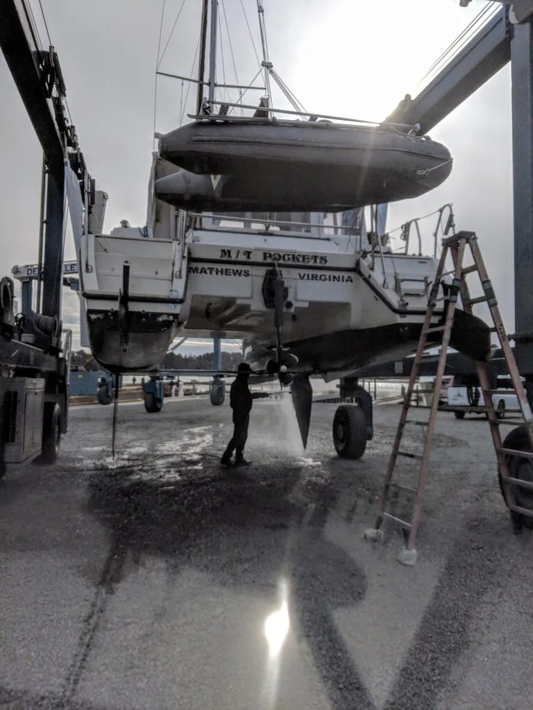 Mavis being power washed after haul out.