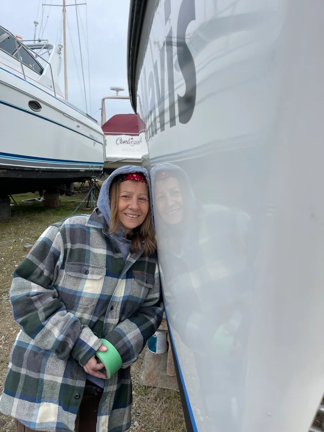 Working beside the hull in the boatyard